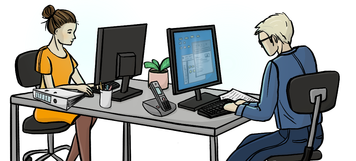 Ein Mann und eine Frau sitzen sich an Schreibtischen gegenüber und arbeiten am Computer.