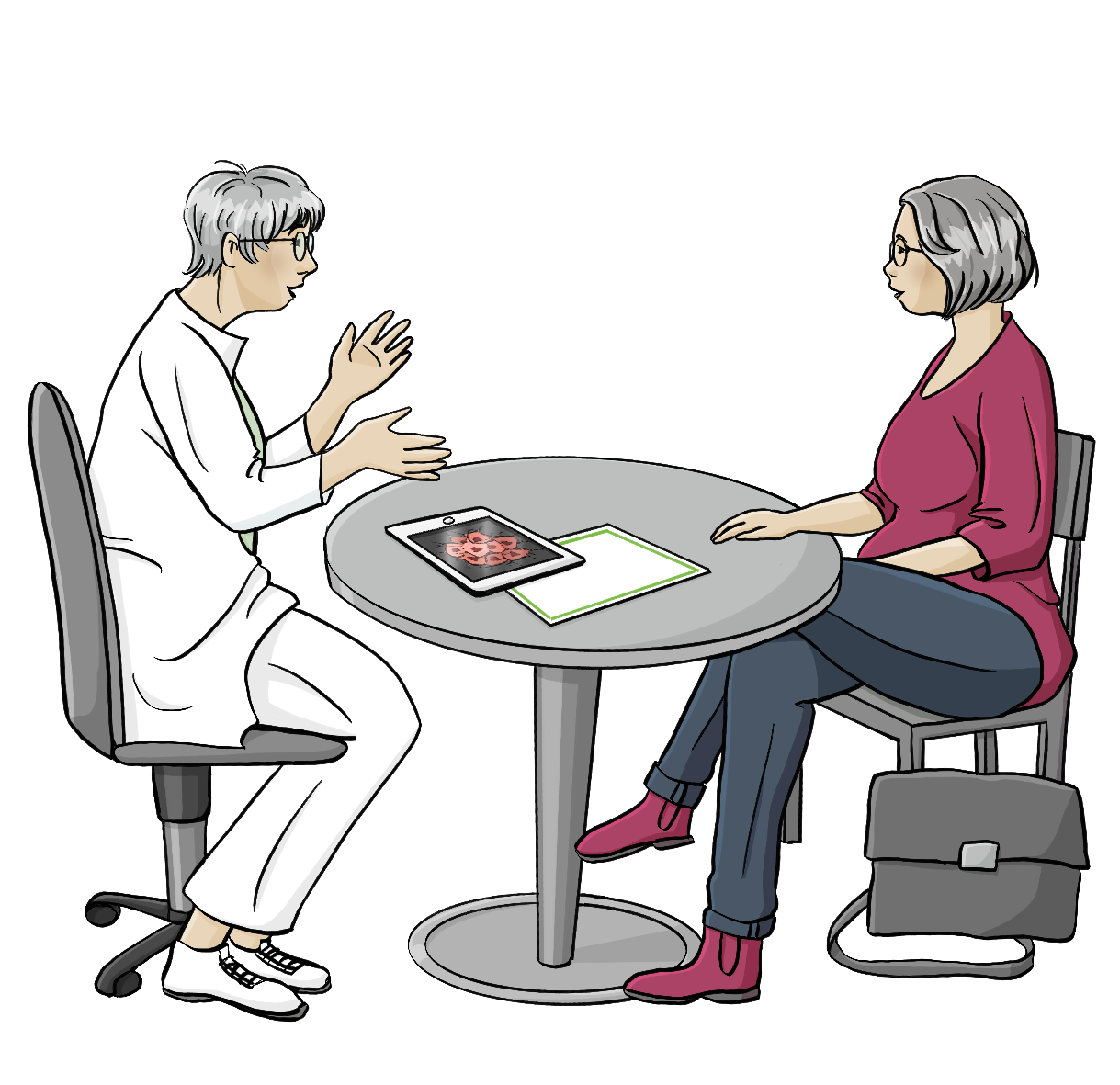 Zwei Frauen sitzen um einen Tisch. Eine von Ihnen trägt einen weißen Kittel und eine weiße Hose, die andere trägt Alltagskleidung. Auf dem Tisch liegt ein Tablett.