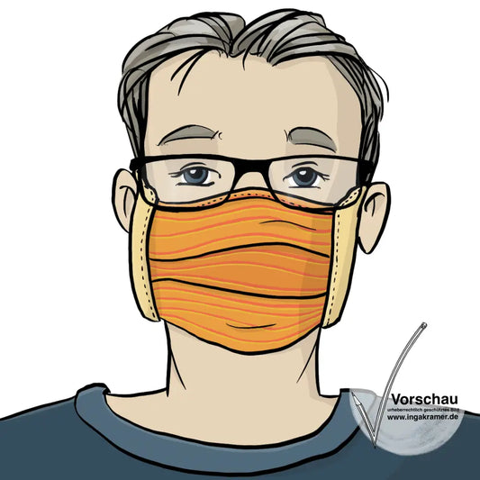 Ein Mann trägt einen Mundschutz aus Stoff und eine Brille.