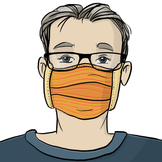 Ein Mann trägt einen Mundschutz aus Stoff und eine Brille.