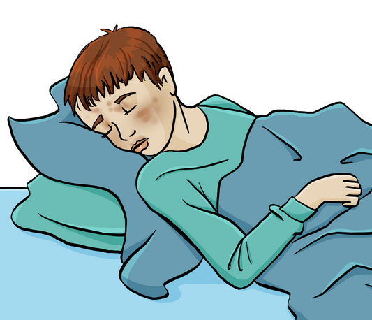 Ein Junge liegt im Bett. Er hat roten Ausschlag und sieht schlapp aus.