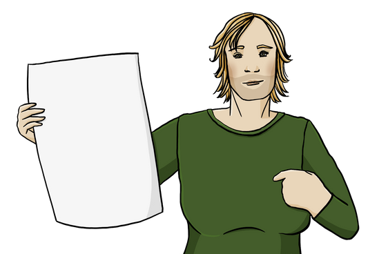 Eine Person mit halblangen Haaren, langen Wimpern und Dreitagebart. Die Person zeigt auf sich. Sie hält ein leeres Plakat in der Hand.