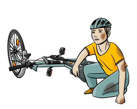 Ein Fahrrad liegt auf dem Boden. Daneben kniet ein Mann mit Fahrradhelm. Er hat Flecken an der Hose und Schrammen an Hand, Ellbogen und Wange.