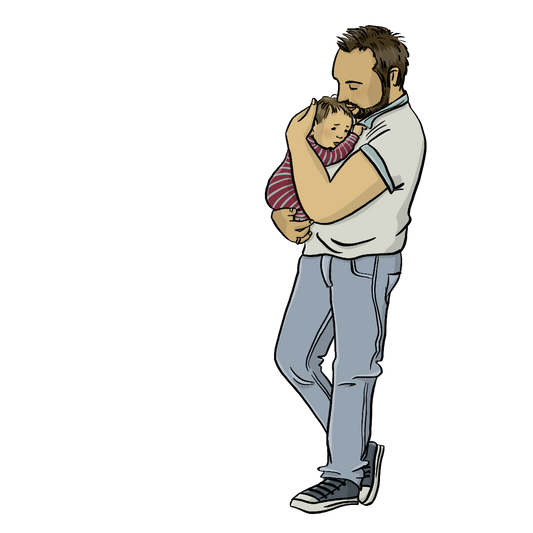 Ein Mann hält ein Baby auf dem Arm.