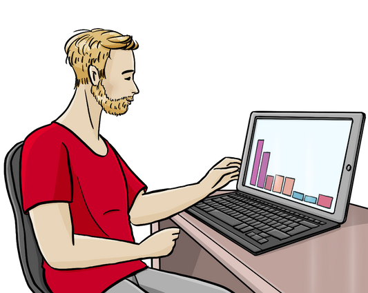 Ein Mann am Schreibtisch. Auf dem Schreibtisch steht ein Computer mit einem Säulendiagramm.