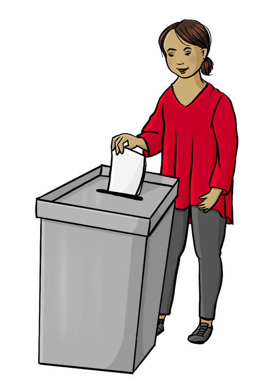 Eine Frau steckt einen Zettel in eine Wahlurne.